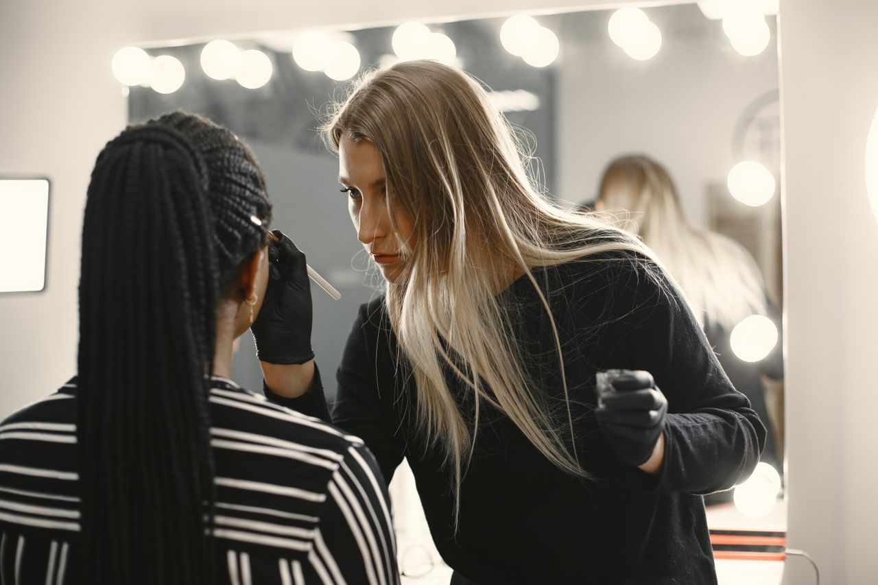 Hair colour being brushed onto a client's hair at the salon